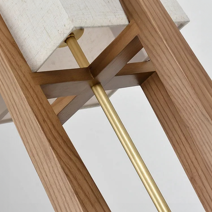 Close-up of a wooden body of lamp with a gold structure on a white background