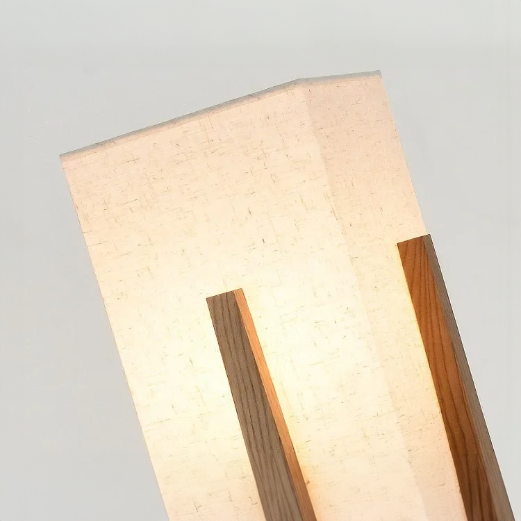 Modern floor light fixture with wooden accents on a neutral background