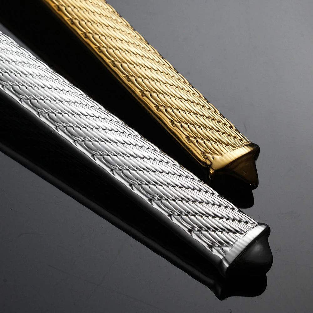 Close-up of a gold and silver textured belt buckle on a dark background